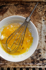 Shake the egg in a bowl, whisk