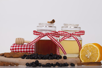 Honey in jar on a wooden background