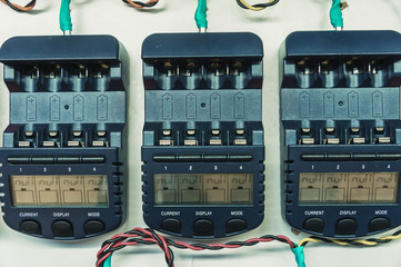 Three chargers on a wall.