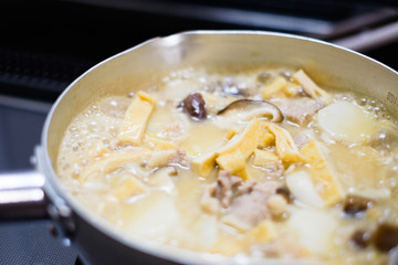 Japanese home cooking. Simmered taro. Simmering.