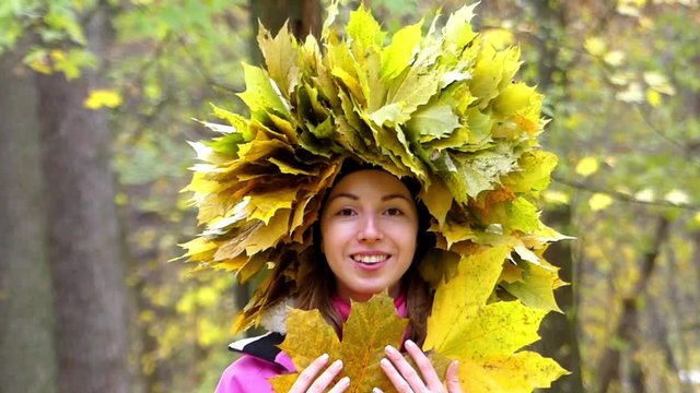 Amazing Autumn's Girl With Wreath of Yellow Leaves on the Head.