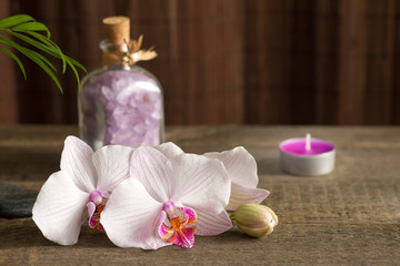 Fototapeta na wymiar Spa concept with candle and orchid abstract still life 