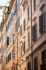 Urban Italian street in Rome with Restaurant sign.