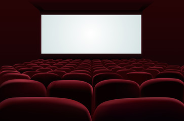 Red seats of cinema in front of blank screen