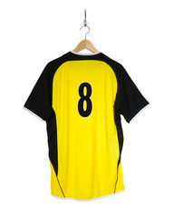 Yellow Football shirt hanging on hook and isolated on white