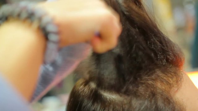 Professional hairdresser creating fashionable hairstyle, hairdressing business