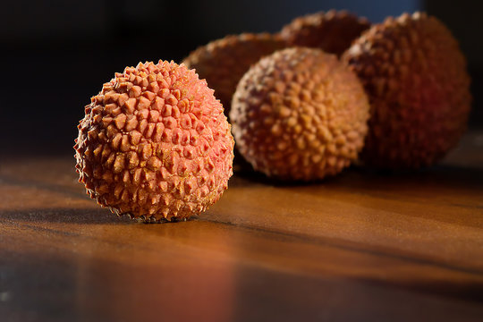 Delicious lychee on wooden background