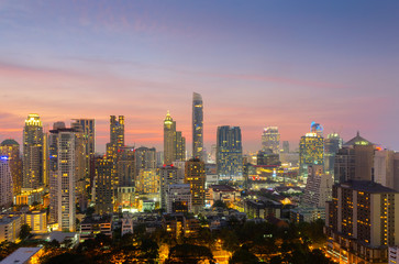 Fototapeta na wymiar Top view of Bangkok modern office buildings, condominium in Bangkok city downtown with sunset sky ,Bangkok is the most populated city in Southeast Asia. Bangkok , Thailand