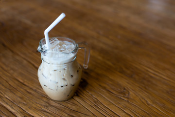 iced milk coffee on wooden table
