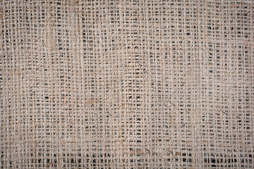 Hessian sackcloth woven texture pattern background in light crea