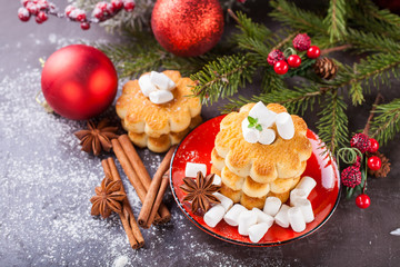 cookies about marshmallows and Christmas balls on a table, selective focus, copy space