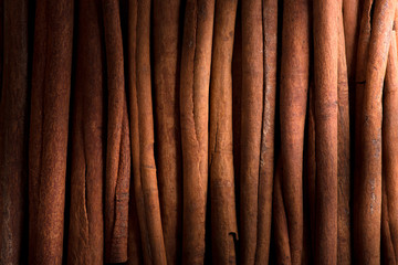 cinnamon sticks background, selective focus.