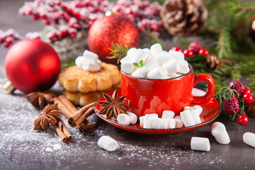 cocoa and cookies about marshmallows and Christmas balls on a table, selective focus, copy space