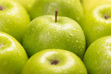 Green fresh apples close up, selective focus.