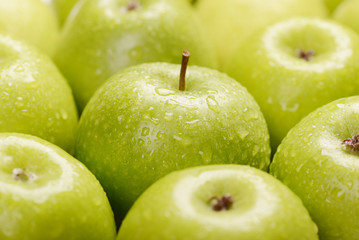 Green fresh apples close up, selective focus.