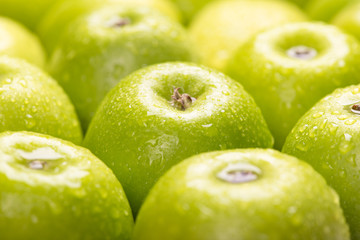 Green fresh apples close up, selective focus.