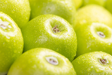 Green fresh apples close up, selective focus.
