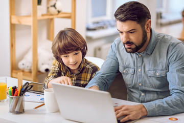 Father and son playing games together