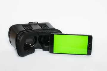 Virtual reality, VR, helmet and smartphone with green screen for key chroma screen, On a white background