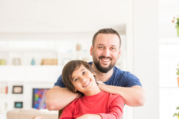 Happy father and son at modern new white home © Jasmin Merdan