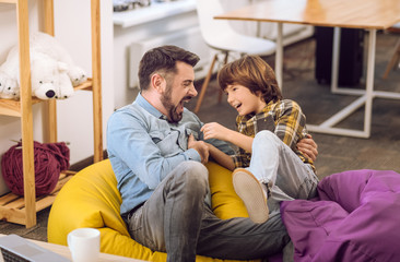 Dad and little boy expressing happiness