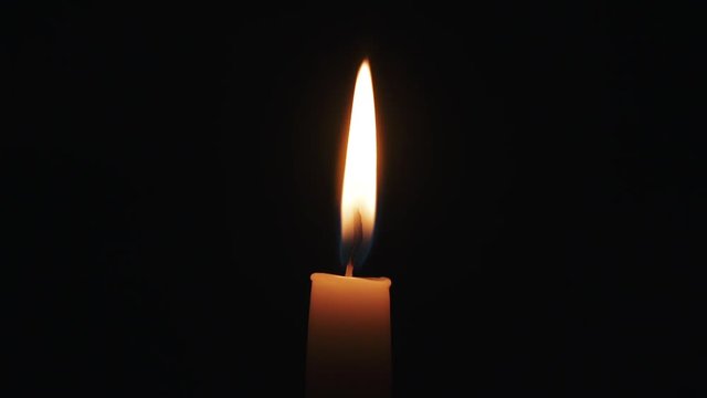 tall candle with dancing on the wind flame in slow motion, 180fps slow motion