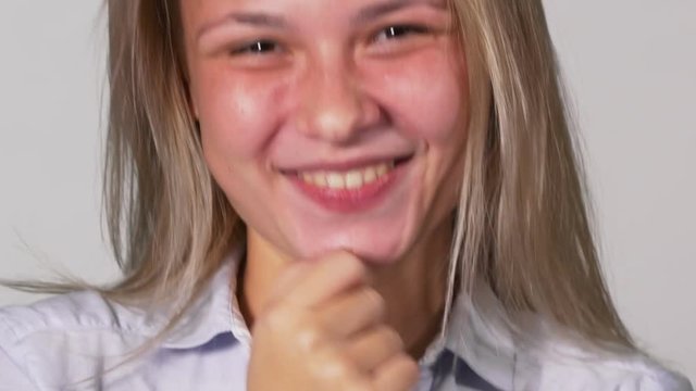 Close up portrait of young blonde woman laughing