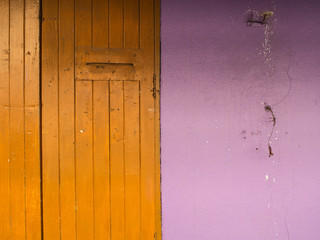 Old Door Yellow with Purple Wall