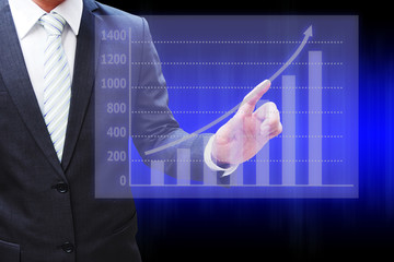 Businessman hand touching the virtual panel of bar chart , busin