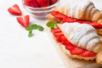 croissant with fresh strawberries, ricotta