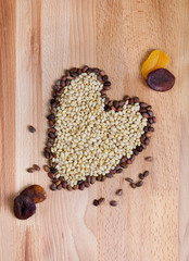 The heart of the pine nuts on a wooden table