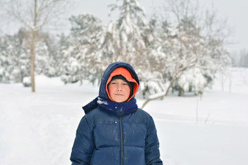 Fototapeta na wymiar The magic of winter . Happy child .