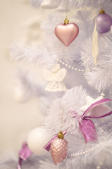 Soft pastel christmas tree decoration on a faux christmas fur-tree
