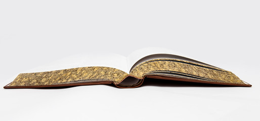 Isolated open book in brown cover