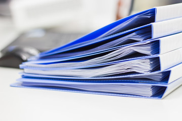 file folder with documents and documents. retention of contracts. 