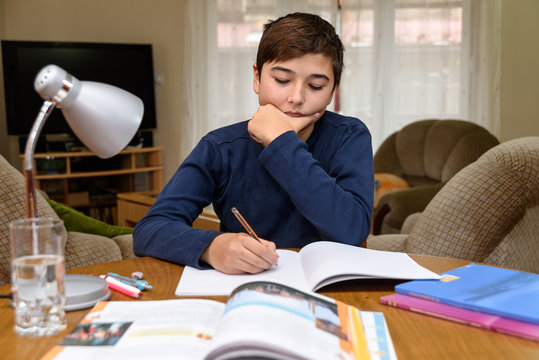 Young boy doing homework for school
