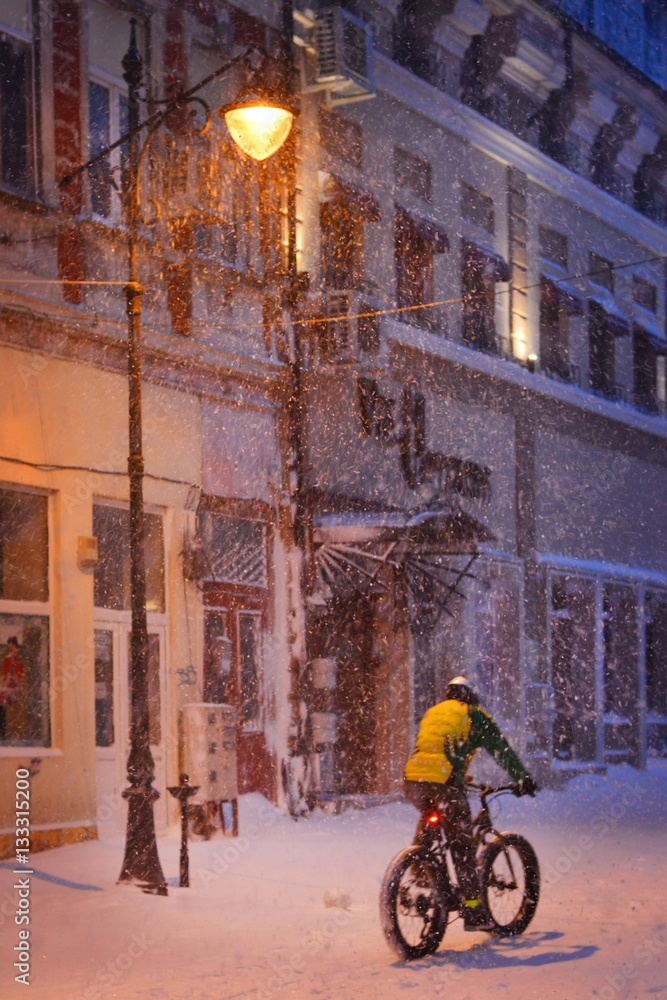 Canvas Prints Winter story. Night snowfall on the street of the city.