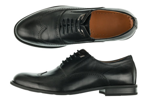 Classic male black leather shoes isolated on a white.