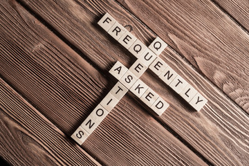 Conceptual media keywords on table with elements of game making crossword