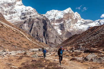 People walking on Footpath in Mountain Valley