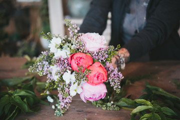Close-up of  womans holding flowers bouquet