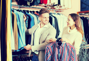 Fototapeta na wymiar Couple in men’s clothes shop