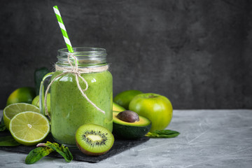 Healthy green smoothie in mason jar. Superfood drink