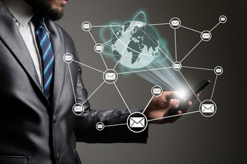 Businessman hands on smartphone with global connection network.