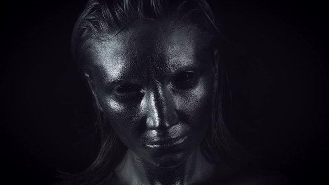 4K Horror Woman with Silver Metallic Make-up Opening Eyes