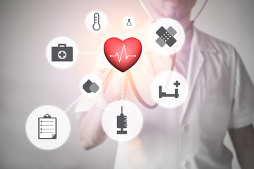 Male doctor with stethoscope and medical icons on surface screen