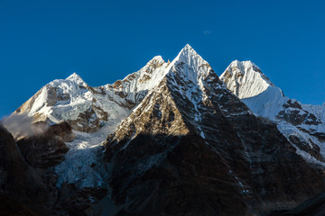 Evening View of Group of pyramidal Shape Mountain Peaks