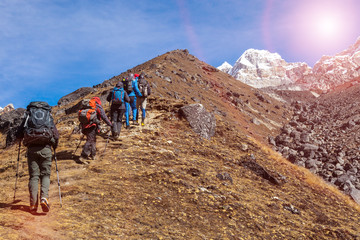 Mountaineering Expedition moving toward high Altitude Mountain Sunshine