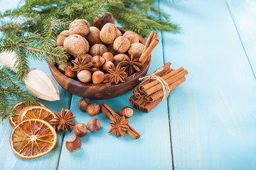 nuts and spices in a bowl on a Christmas table, selective focus, copy space