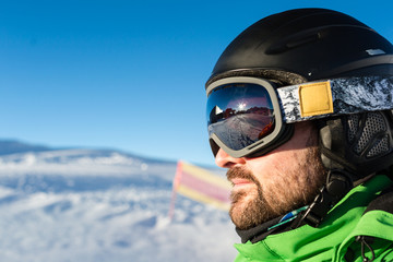 Male skier with large oversized ski goggles